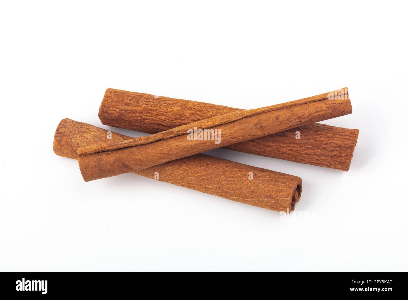 Dried Cinnamon sticks isolated over white background Stock Photo