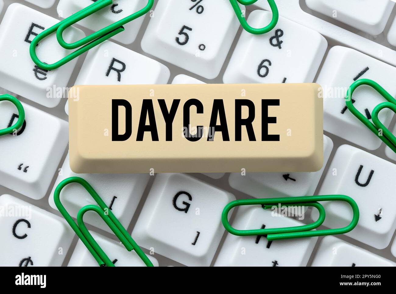 Hand writing sign Daycare. Word Written on offering care to preschool