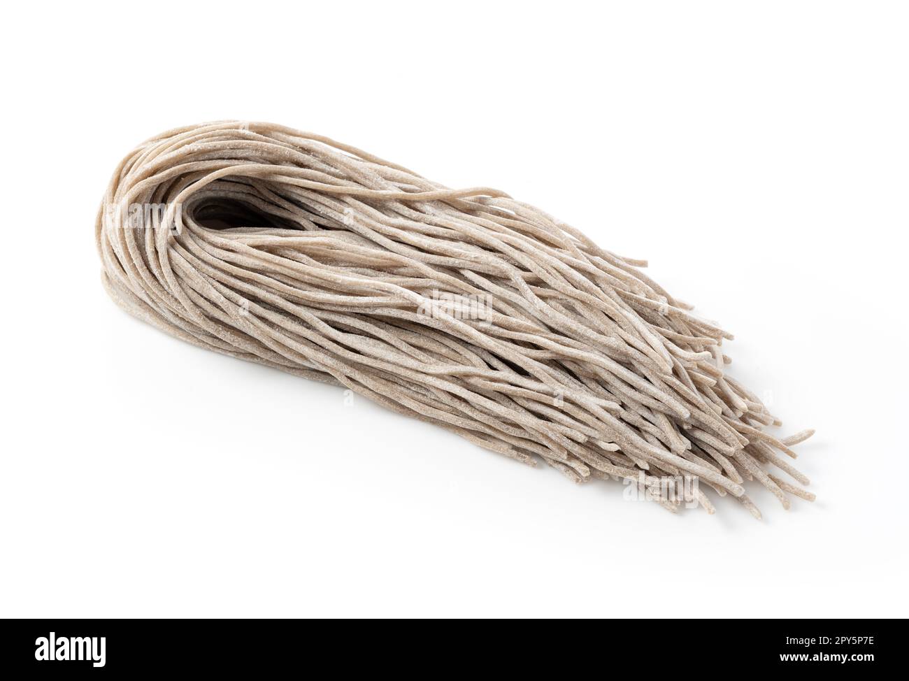 Raw soba noodles placed on a white background. Soba before boiling