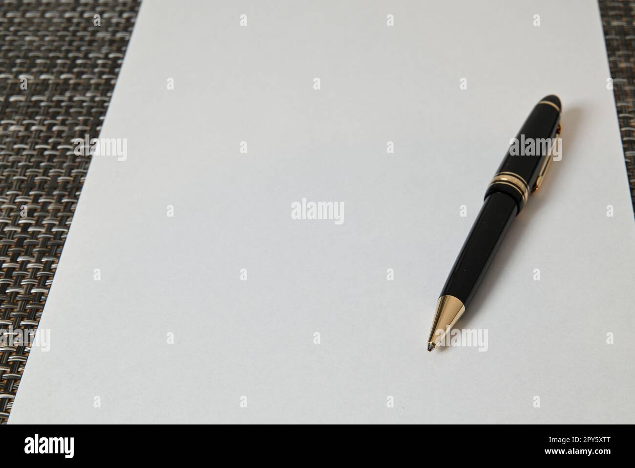Ballpoint pen on white sheet of paper Stock Photo