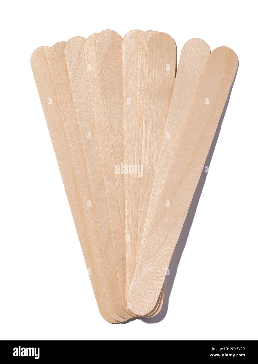 Wooden sticks for applying wax and cosmetic procedures on a white