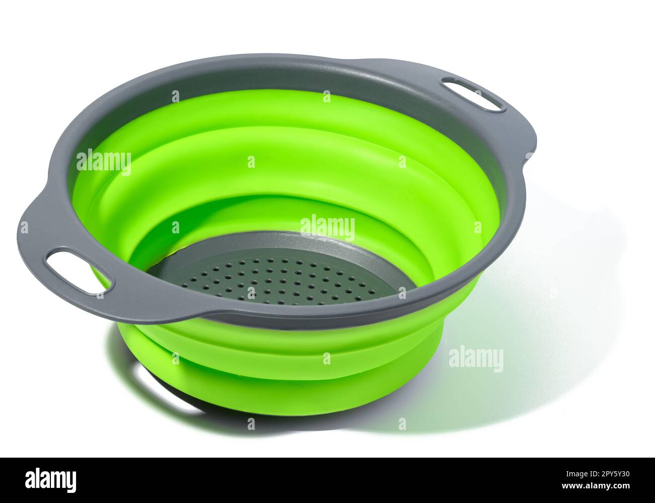 Plastic green collapsible colander on white isolated background Stock Photo Alamy