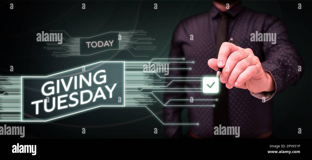 Hand writing sign Giving Tuesday. Business overview international day of charitable giving Hashtag activism Stock Photo