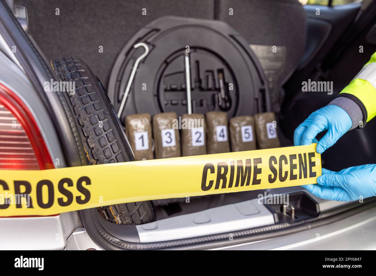 Police seize drug in the trunk of a vehicle during traffic stop Stock Photo