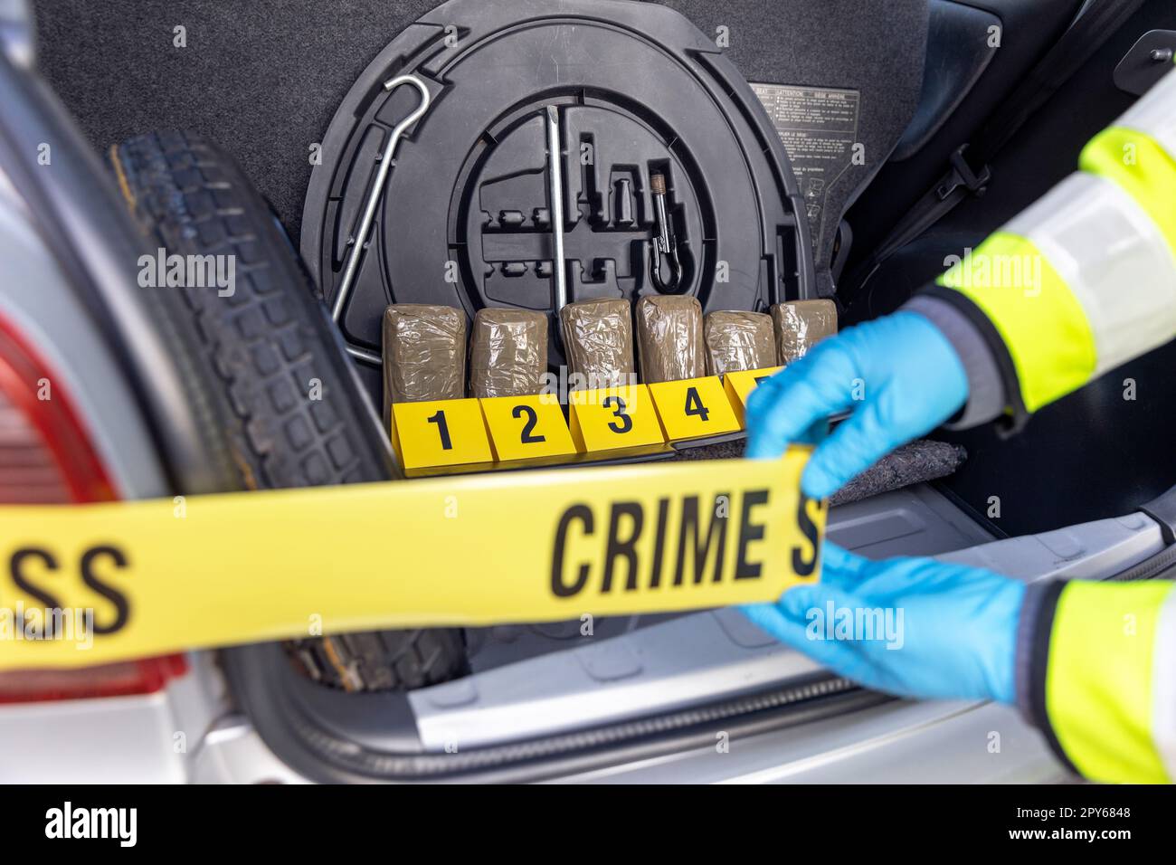 Police seize drug in the trunk of a car during traffic stop Stock Photo