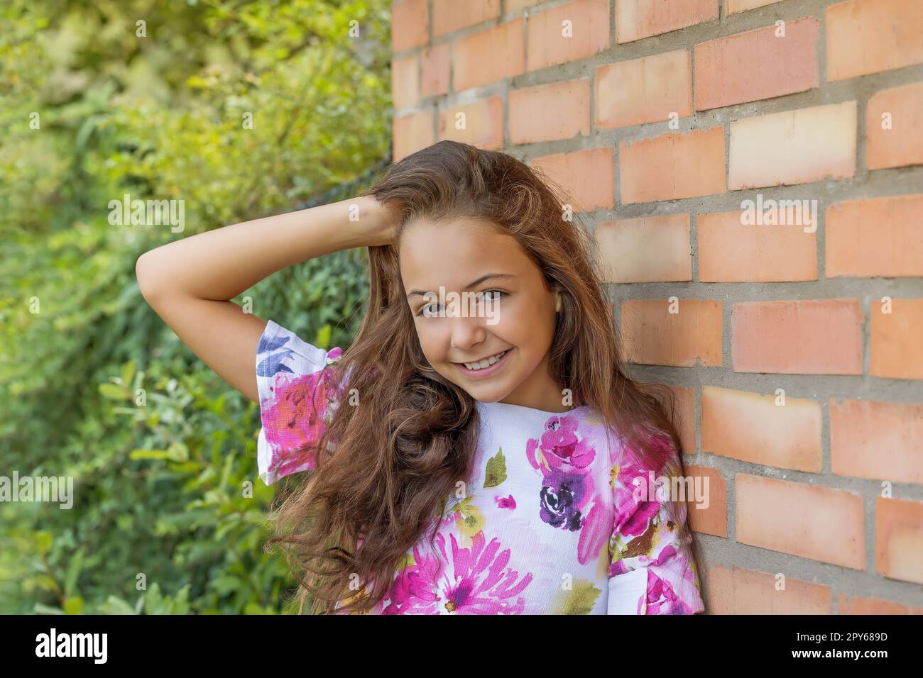 Portrait of smiling little girl outdoors Stock Photo - Alamy