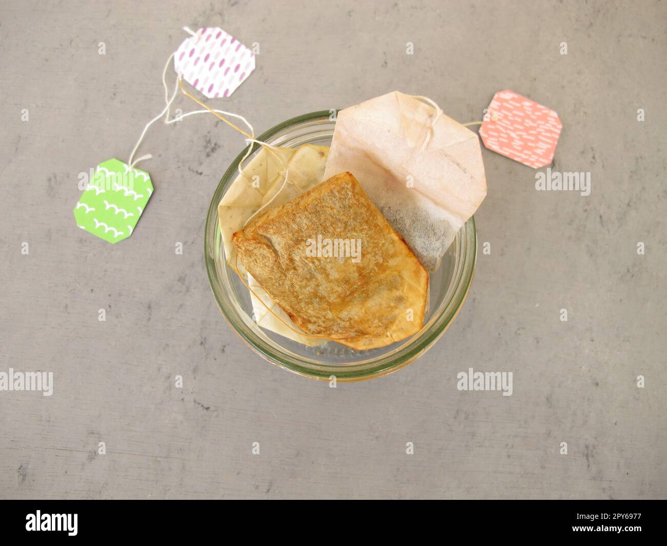 Used dried tea bags in a glass jar for homemade plant fertilizer for