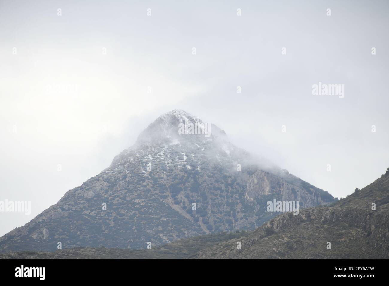 very rare snow in the mountains of Guadalest, Alicante province, Costa Blanca, Spain Stock Photo