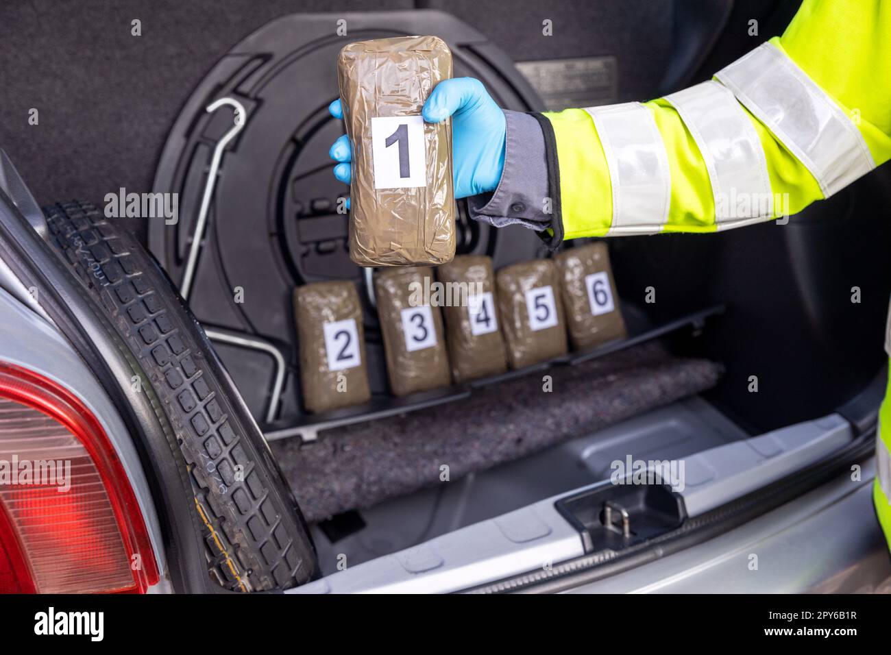 Police seize drug in the trunk of a vehicle during traffic stop Stock Photo