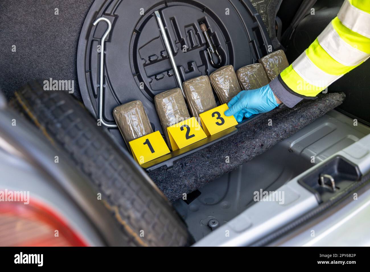 Police seize drug in the trunk of a car during traffic stop Stock Photo
