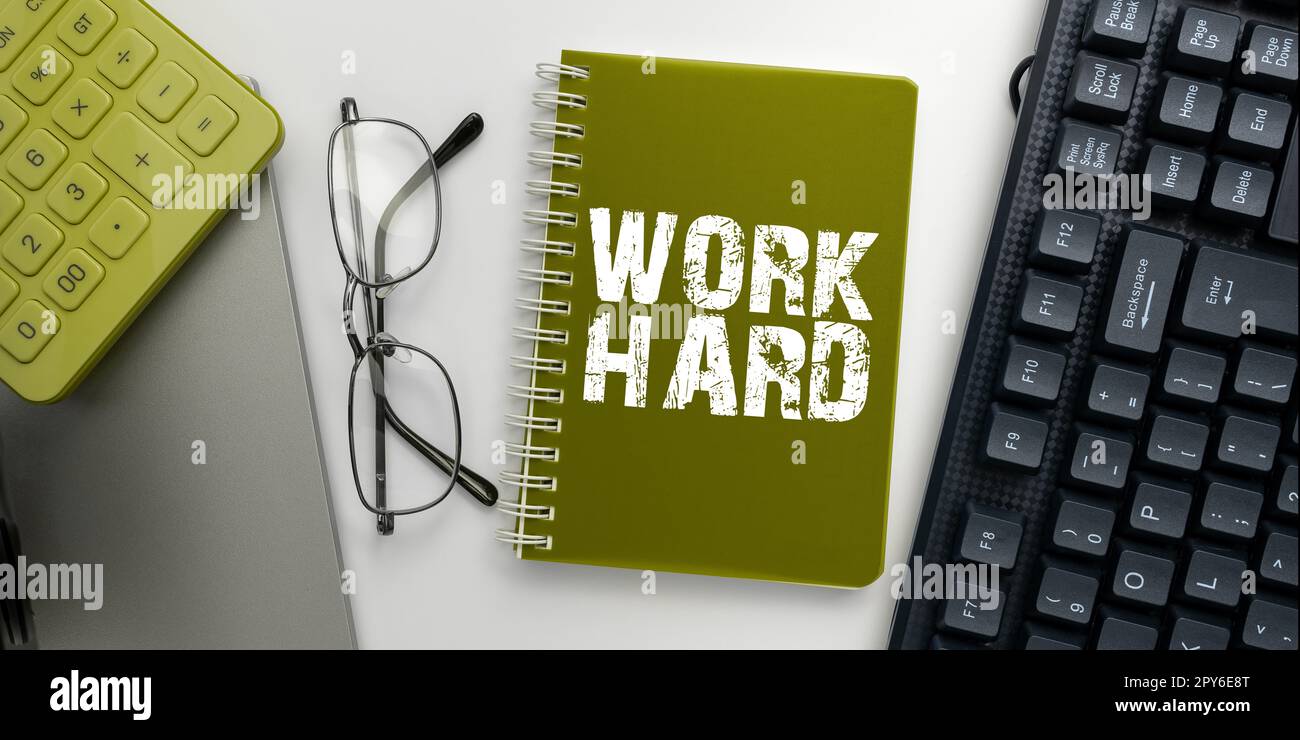 Sign displaying Work Hard. Word for Laboring that puts effort into doing and completing tasks Stock Photo