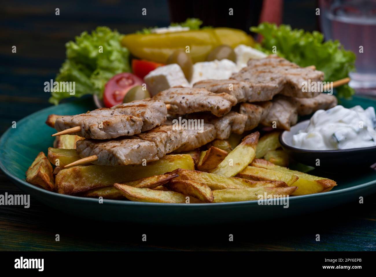 greek souflaki with french fries Stock Photo - Alamy