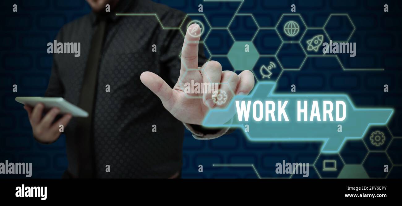 Text sign showing Work Hard. Word for Laboring that puts effort into doing and completing tasks Stock Photo