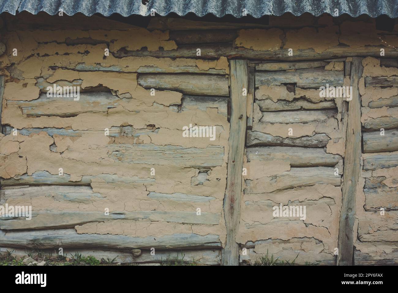 Close up old plastered log building concept photo Stock Photo