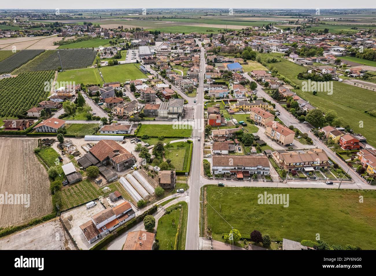 Captivating aerial perspective of a quaint village nestled amidst the ...