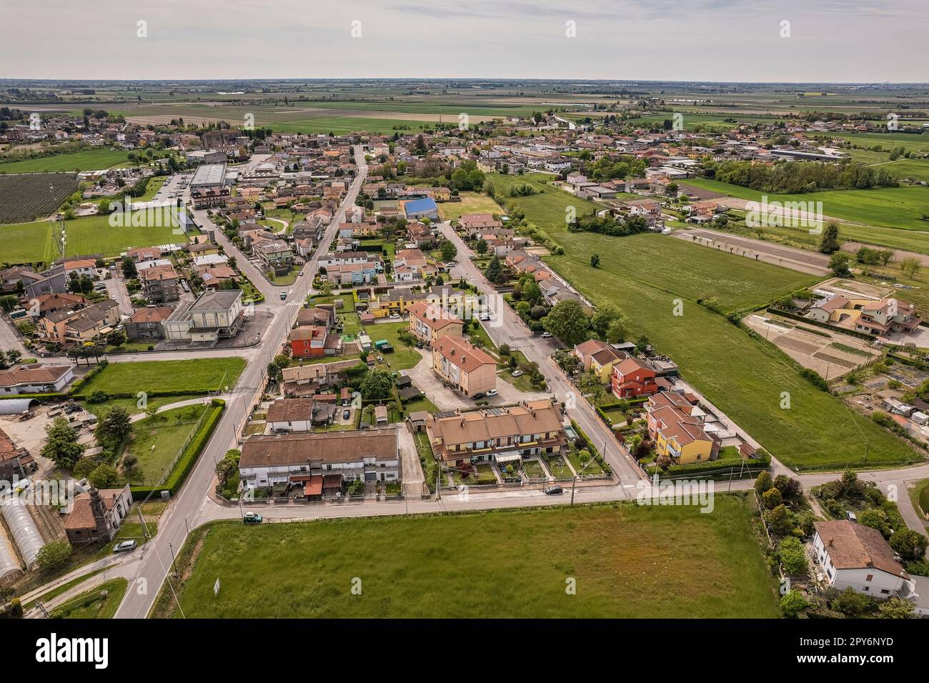 Captivating aerial perspective of a quaint village nestled amidst the ...