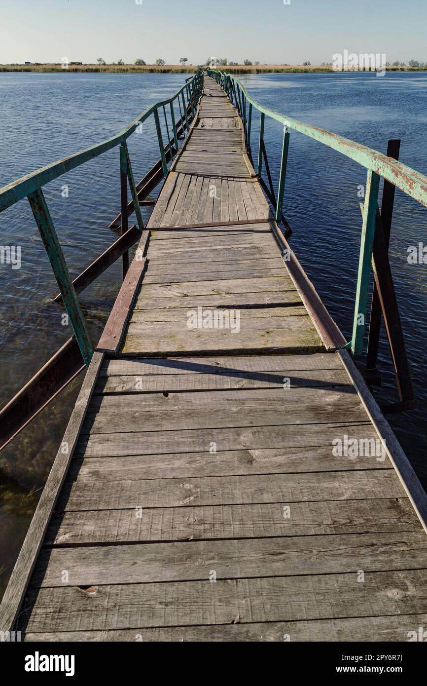 Bridge connecting river banks landscape photo Stock Photo - Alamy