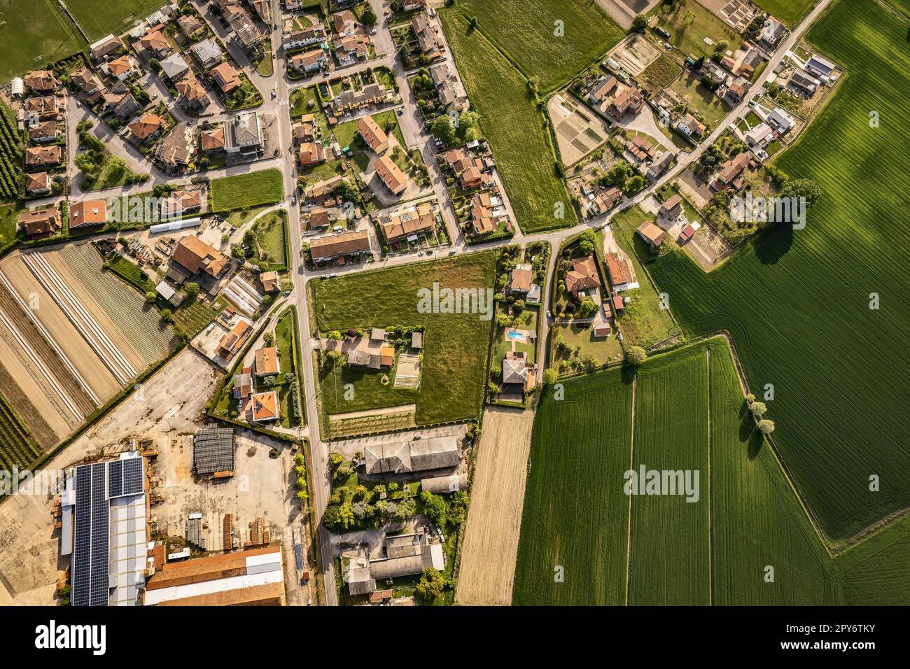 Captivating aerial perspective of a quaint village nestled amidst the ...