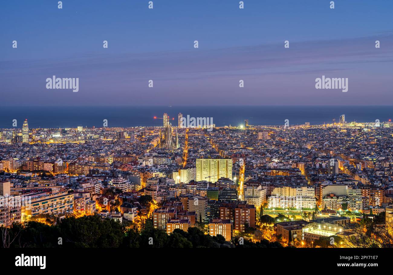 The skyline of Barcelona in Spain at twilight Stock Photo
