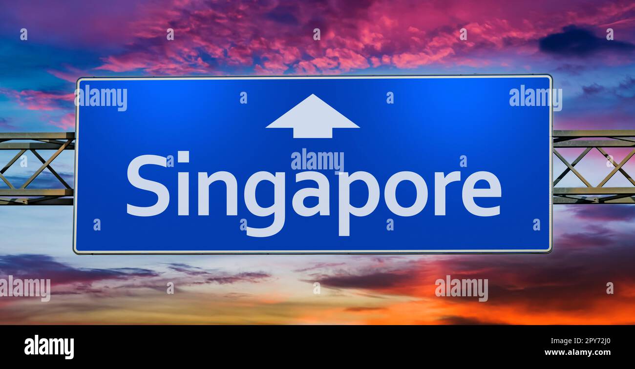 Road sign indicating direction to the city of Singapore Stock Photo