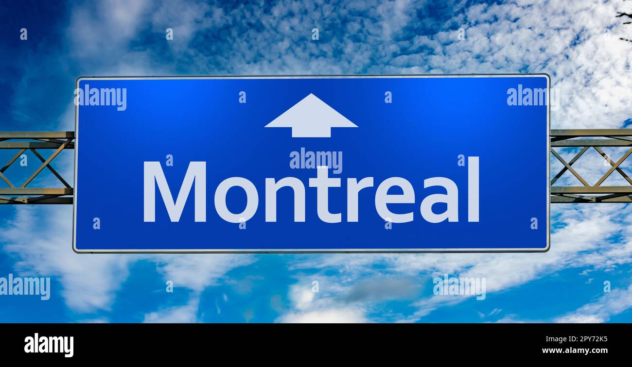Road sign indicating direction to the city of Montreal Stock Photo