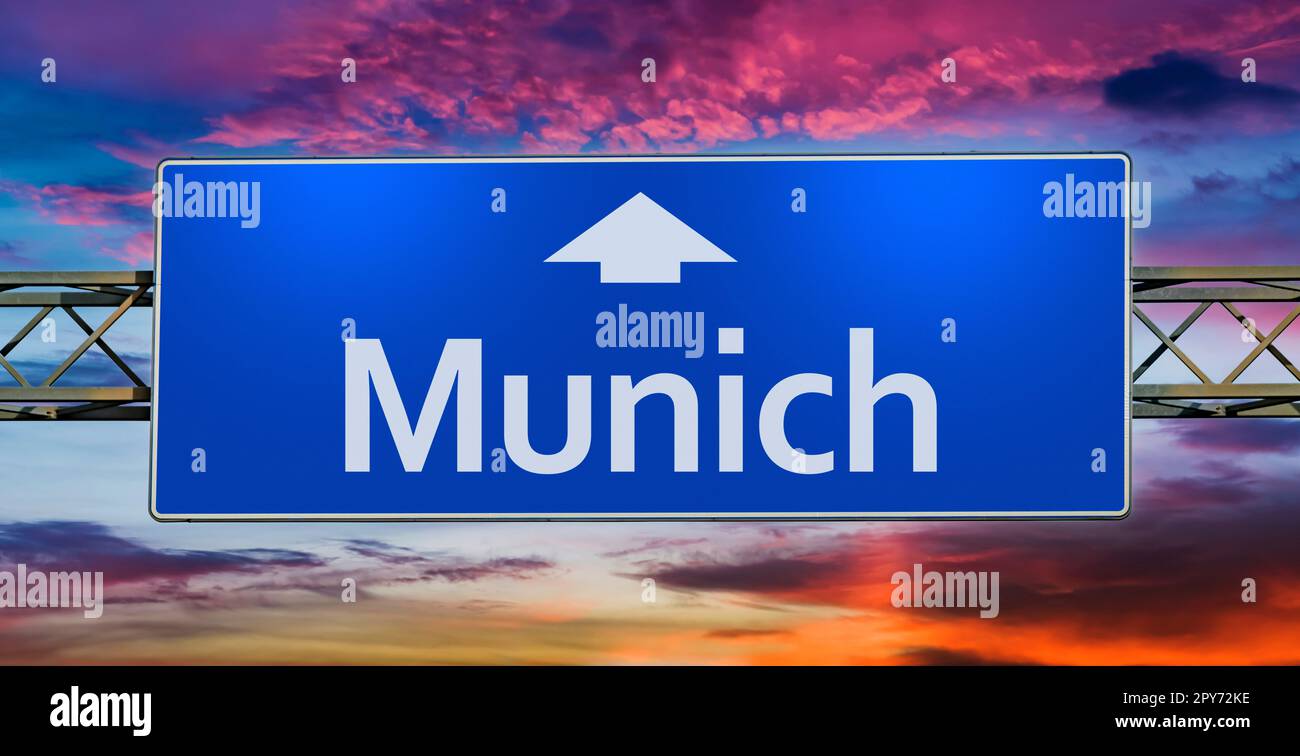 Road sign indicating direction to the city of Munich Stock Photo