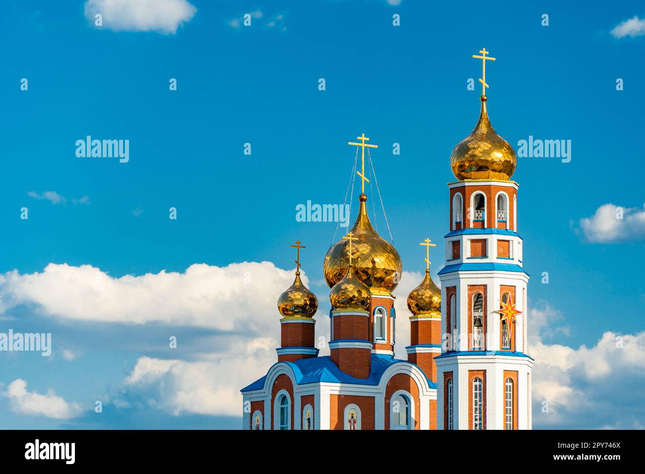 Gospel of Jesus Christ. The religious church is a chapel for praying to God.Golden domes with a crucifix at the top.A holy place for Orthodox Christians and Catholics.Holy is the Savior of the spirit Stock Photo