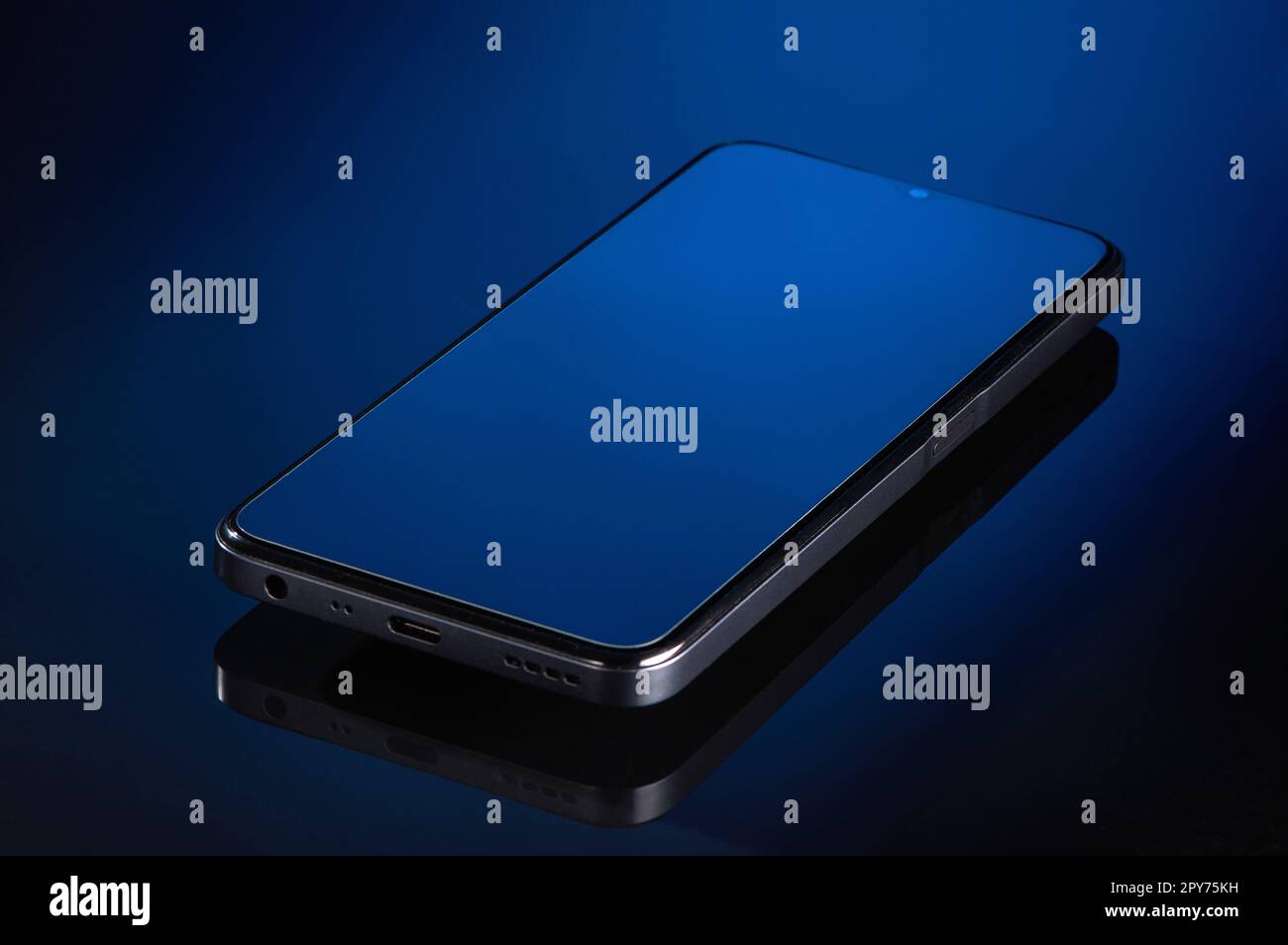 the smartphone is lying on a glass surface Stock Photo