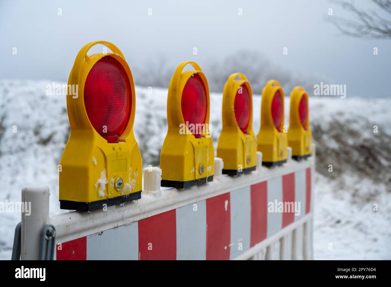 Closed because of snow, fence do not pass. barricade Stock Photo