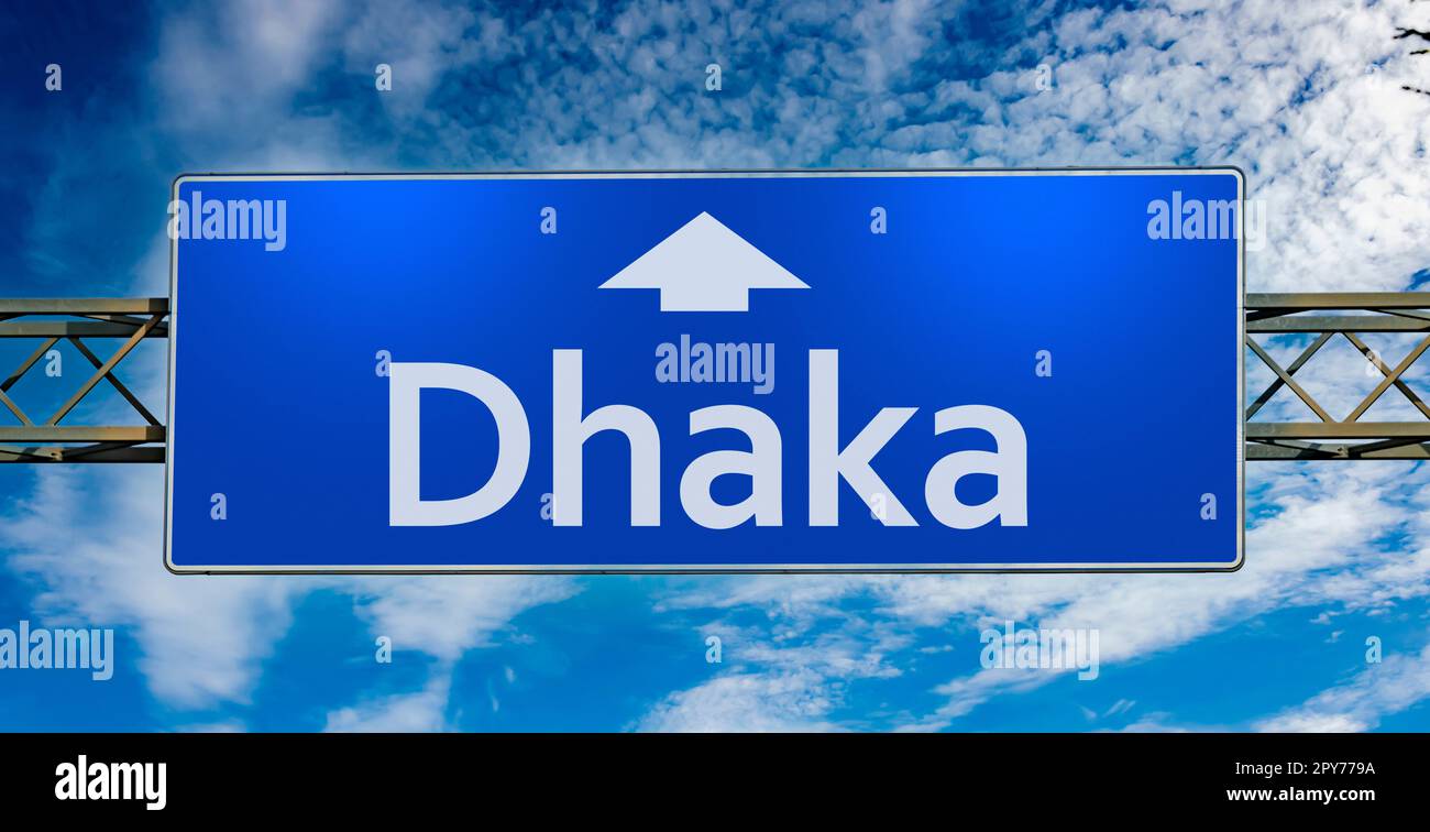 Road sign indicating direction to the city of Dhaka Stock Photo