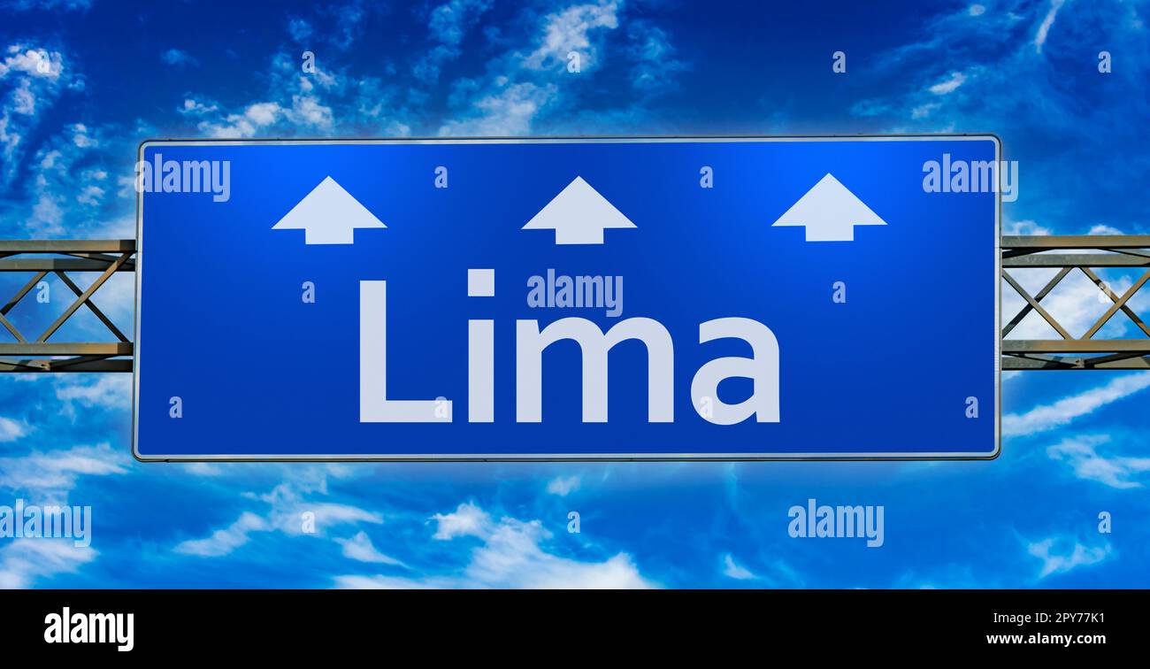 Road sign indicating direction to the city of Lima Stock Photo
