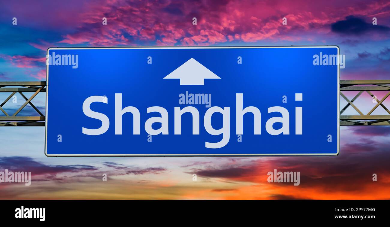 Road sign indicating direction to the city of Shanghai Stock Photo