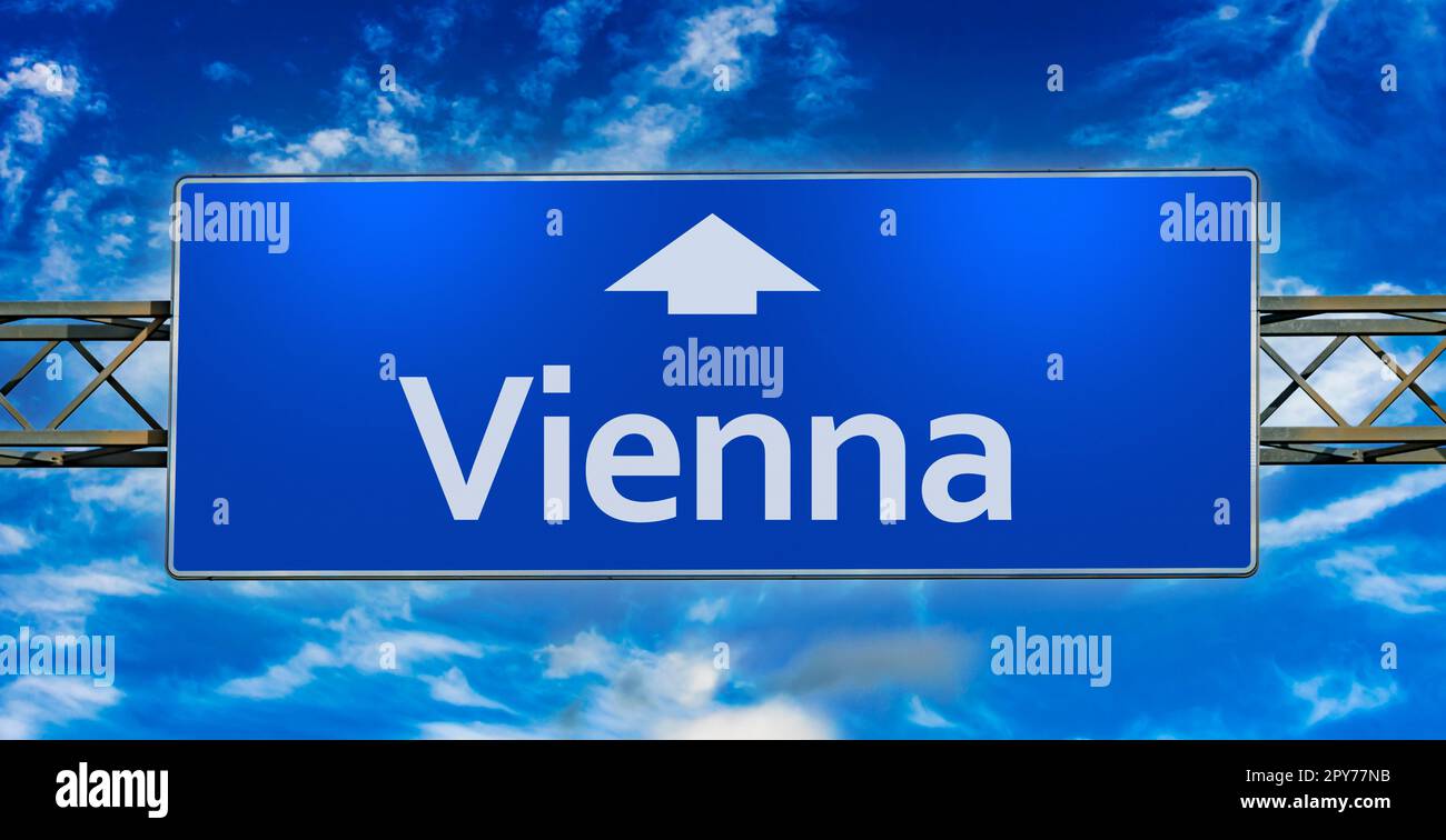 Road sign indicating direction to the city of Vienna Stock Photo