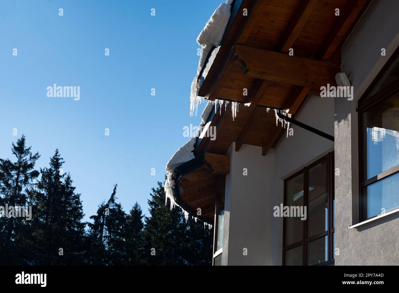 Icicles on a roof Stock Photo