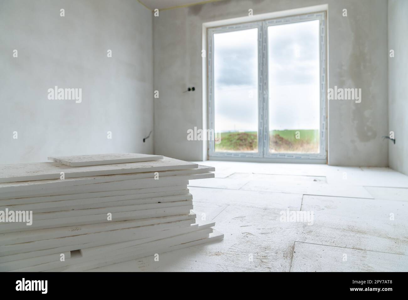 insulation of floors with polystyrene on the construction site Stock Photo