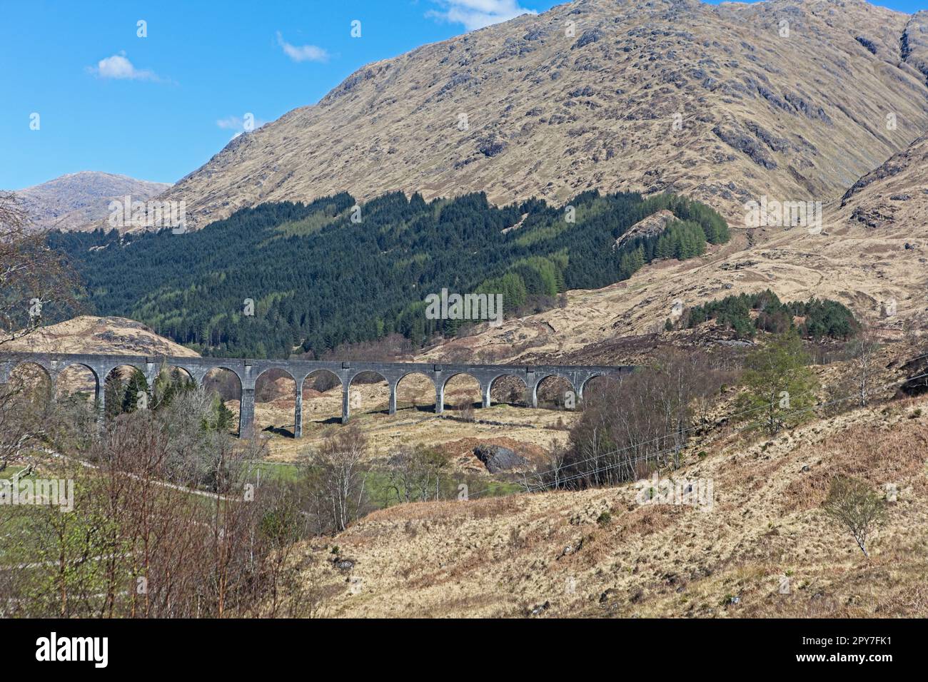 Glenfinnan Viaduct on the West Highland train line. Built from concrete by Robert McAlpine. Used as a backdrop in many movies Stock Photo