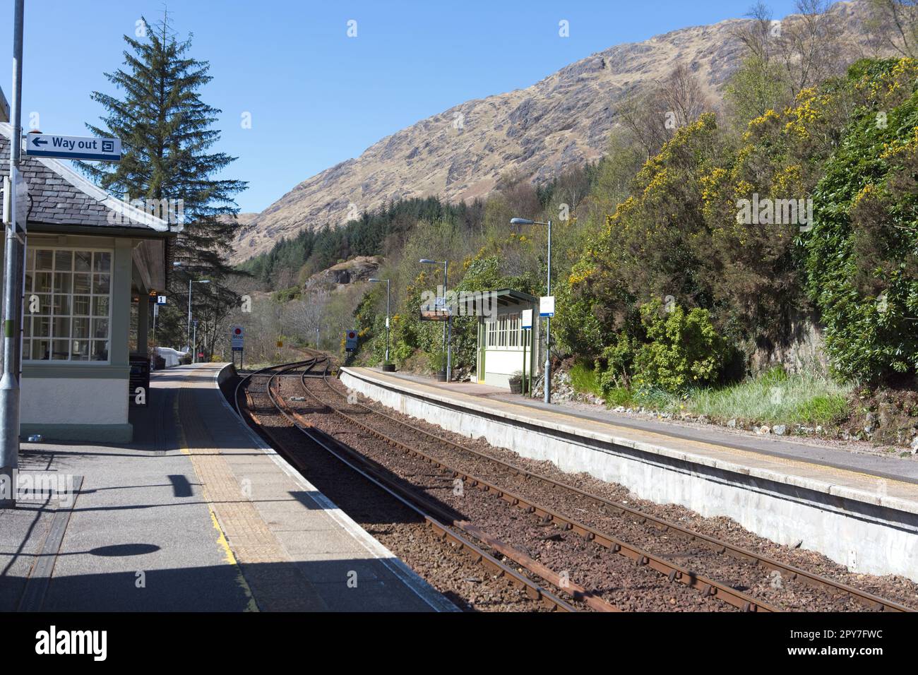 Glenfinnan railway station on the West Highland line, Scottish Highlands. The single track uses  Radio Electronic Token Block signalling Stock Photo