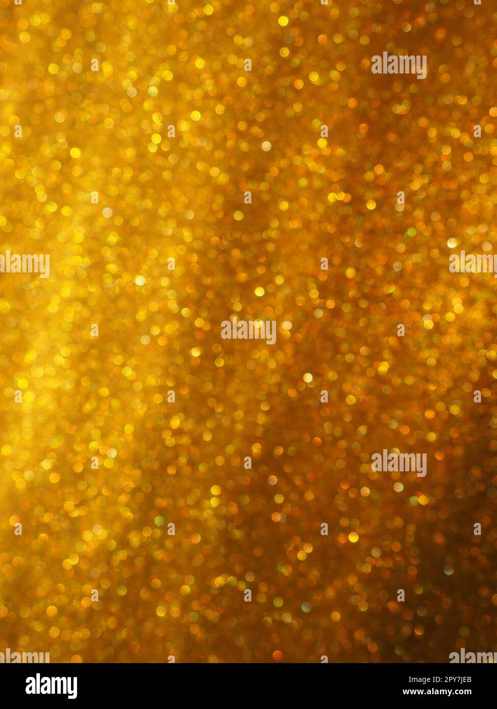 Bokeh light of gold glitters. Golden glitter texture background ...