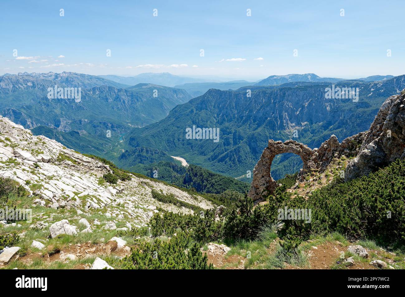 View of circular rock formation in the mountains. Natural monument Hajdučka vrata in Čvrsnica mountain. Famous hiking place in Bosnia and Herzegovina. Stock Photo