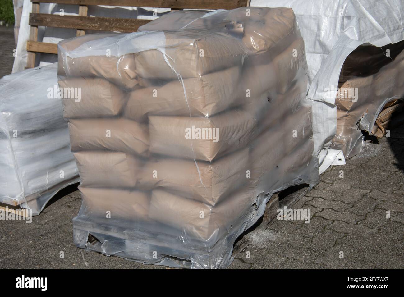 Bags of cement on a pallet at the construction site Stock Photo Alamy