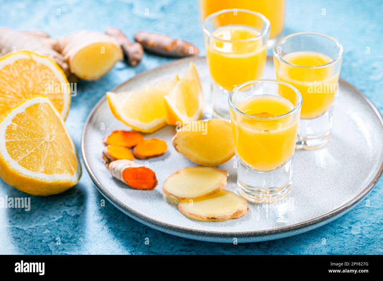 Boosting immune system - homemade healthy Ginger Lemon Turmeric Shot Stock Photo