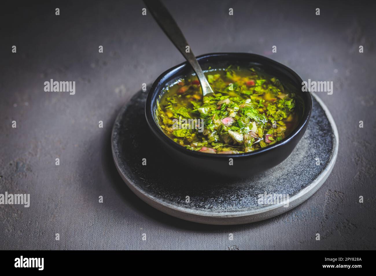 Chimichurri verde - Fresh traditional chimichurri sauce for barbecue meat Stock Photo