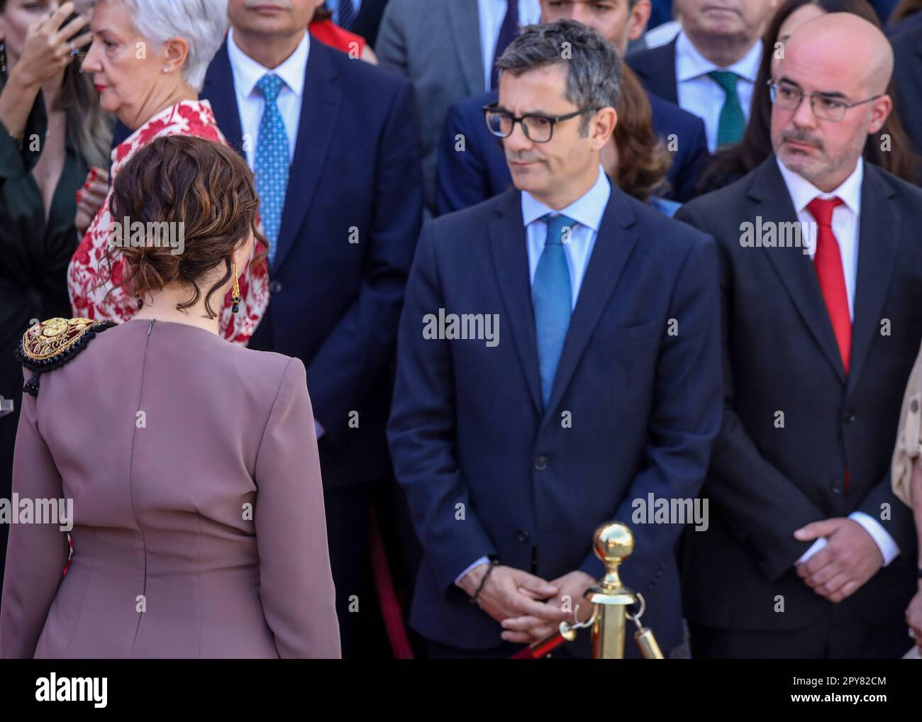 Felix Bolaños (C), Minister of the Presidency of Spain, watches Isabel Diaz Ayuso, President of the Community of Madrid during the ceremony for the 2 May festivities in Madrid. One more year Madrid has celebrated the festivities of May 2. At the reception and official acts organized by the Presidency of the Community of Madrid at the Royal Post Office in Puerta del Sol, one of the protagonists were Felix Bolaños, Minister of the Presidency, Relations with the Courts and Democratic Memory of the Government of Spain to whom the head of protocol of the Community of Madrid prevented him from acce Stock Photo