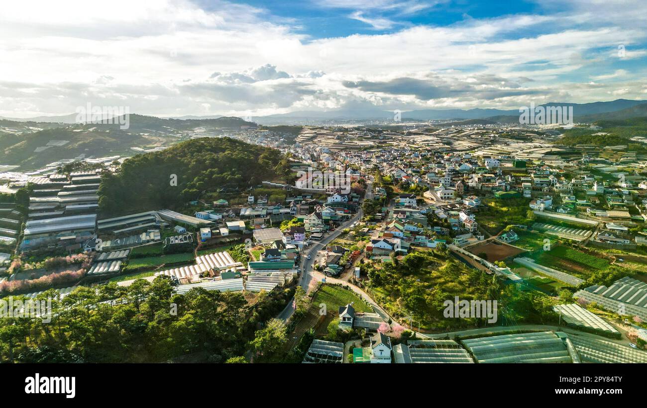 Mesmerizing Mountain Skyline: HDR Shot of Da Lat City, Vietnam with Stunning Blue Sky and Majestic Mountains on the Horizon Stock Photo
