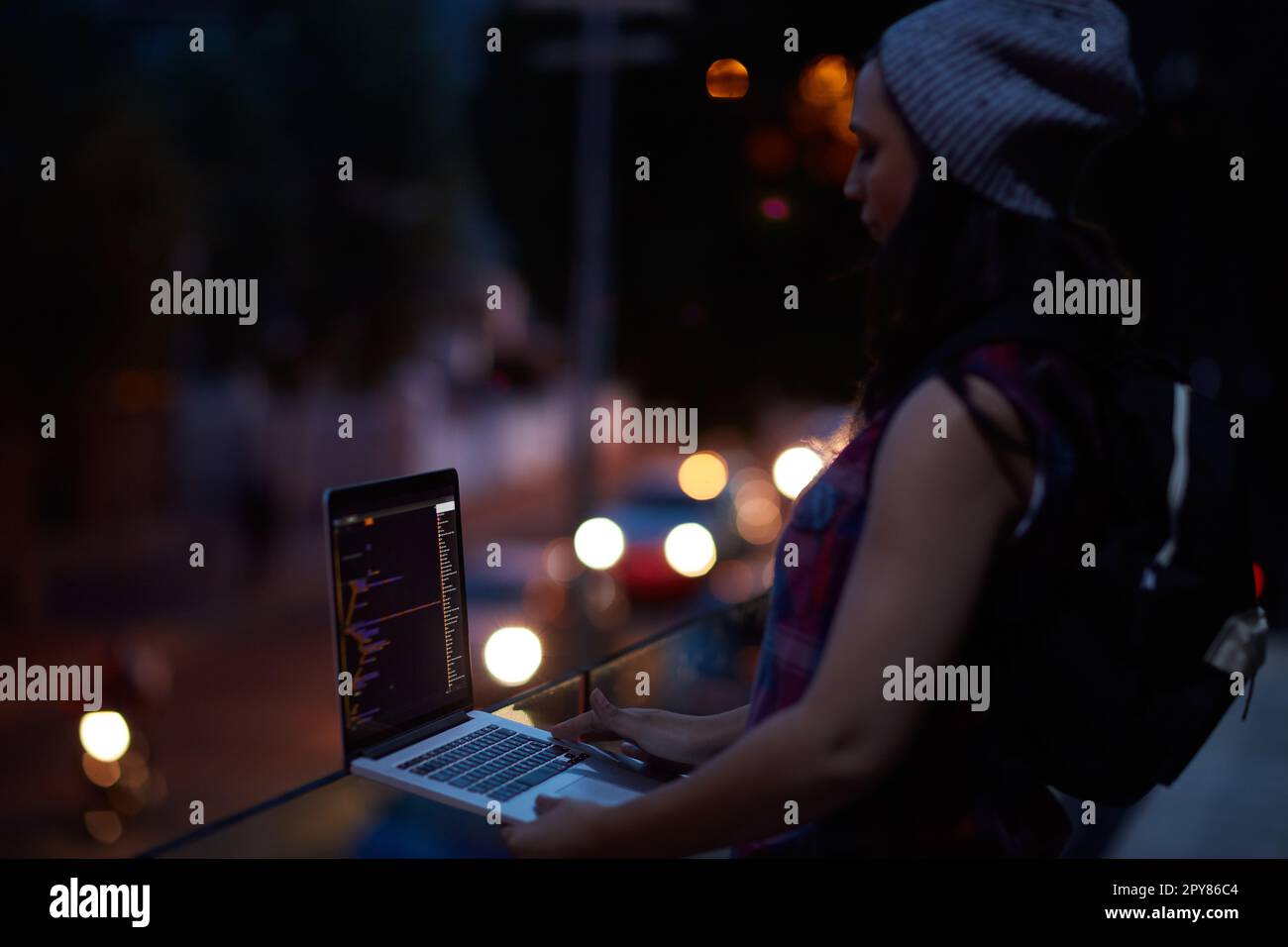 Destroying all the data. a young hacker using a laptop. Stock Photo