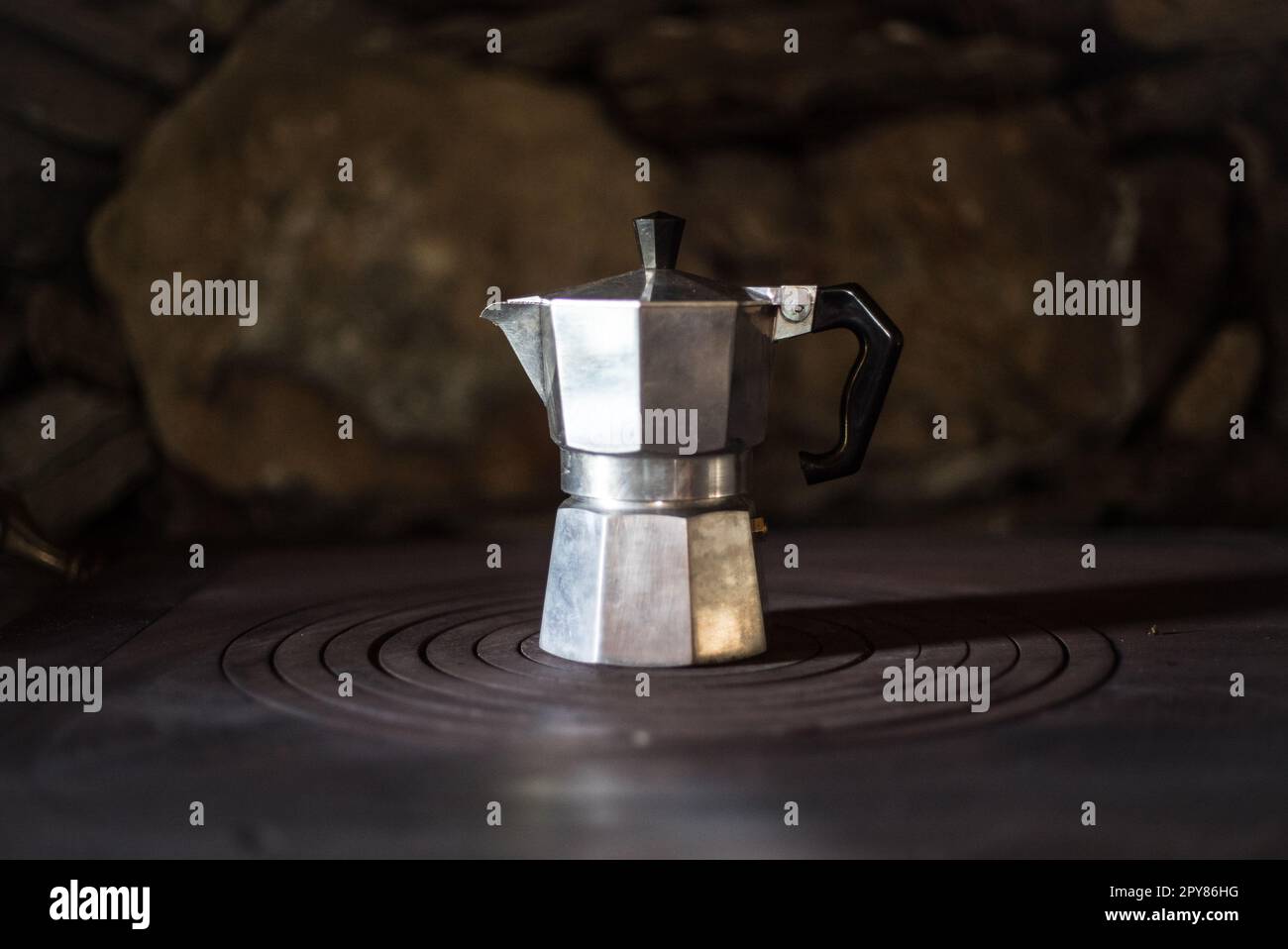 https://c8.alamy.com/comp/2PY86HG/close-up-of-an-italian-coffee-machine-on-an-old-stove-2PY86HG.jpg