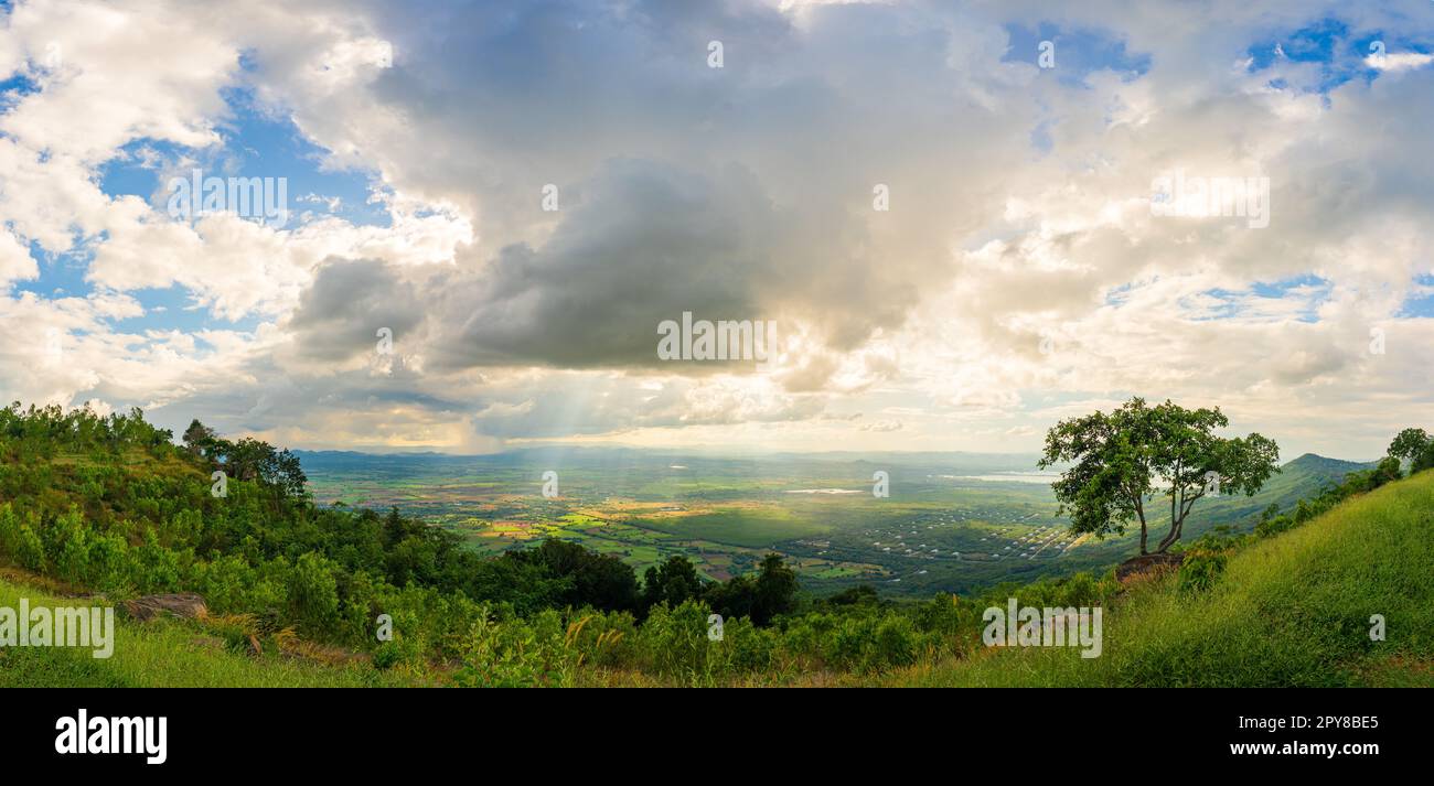 Mountain landscape with sunset on the cloudy sk Stock Photo