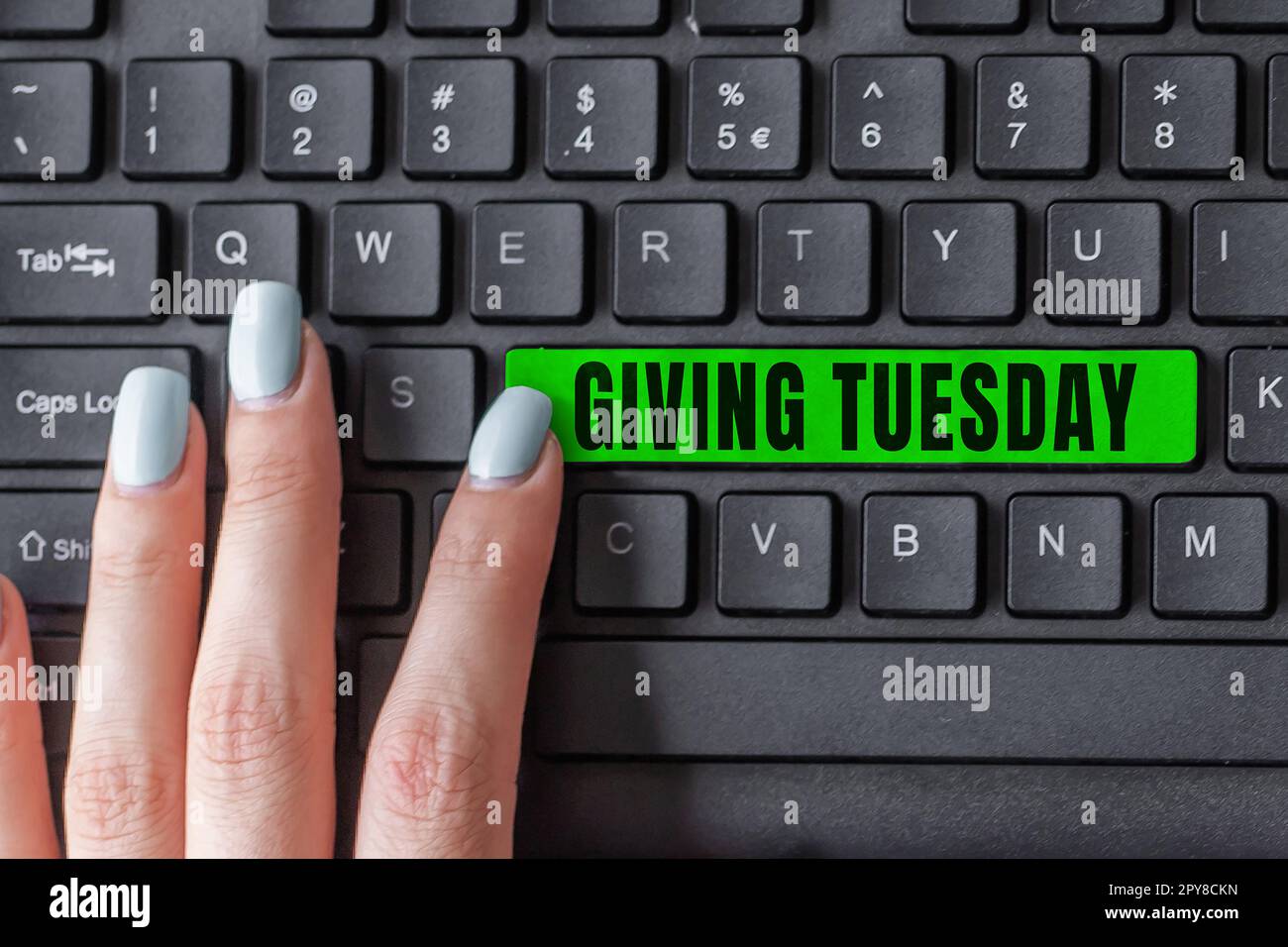 Hand writing sign Giving Tuesday. Word Written on international day of charitable giving Hashtag activism Stock Photo
