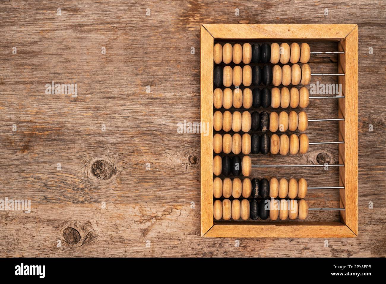 Vintage abacus on wooden background with copy space Stock Photo