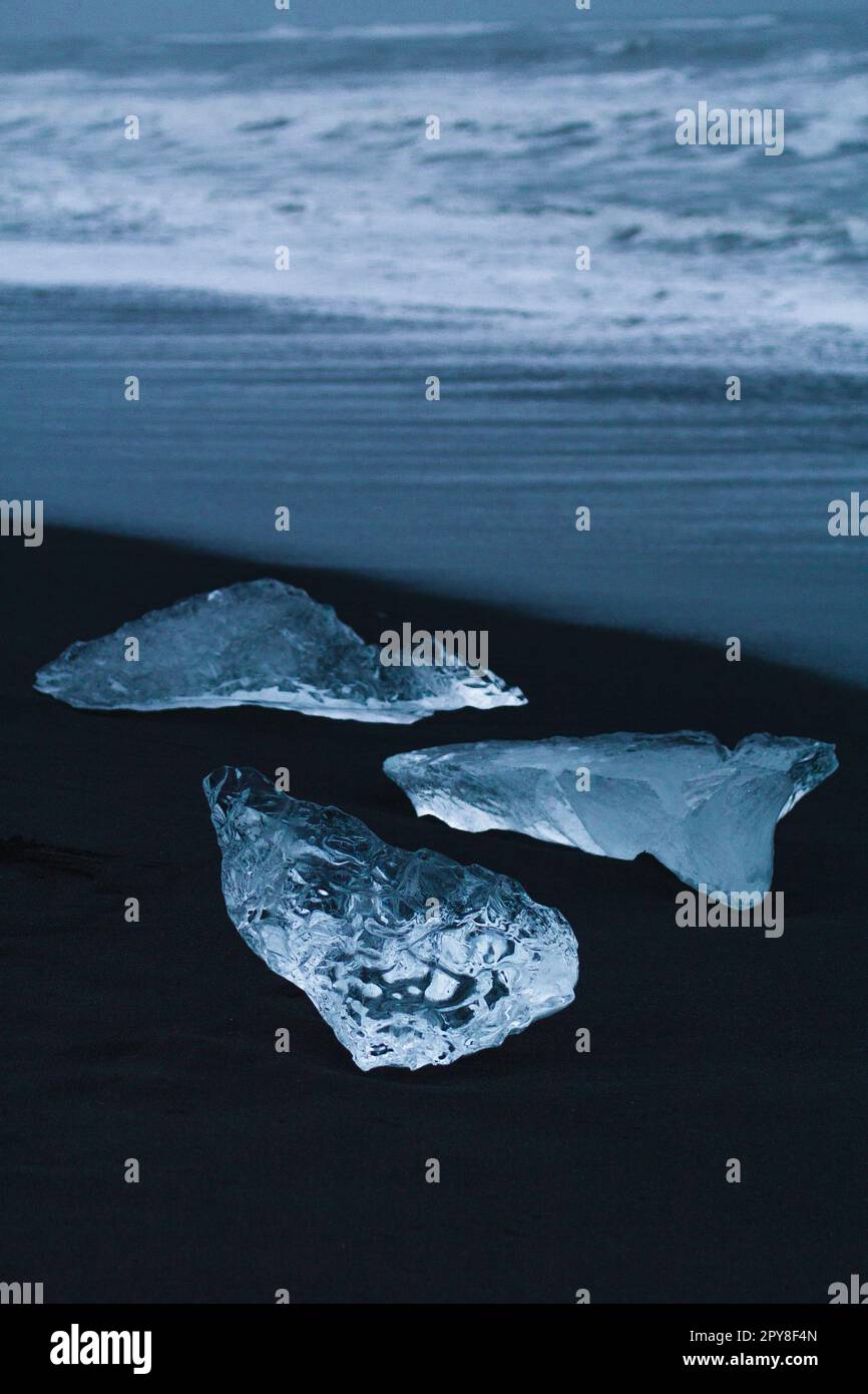 Close up clear ice on Reynisfjara beach concept photo Stock Photo